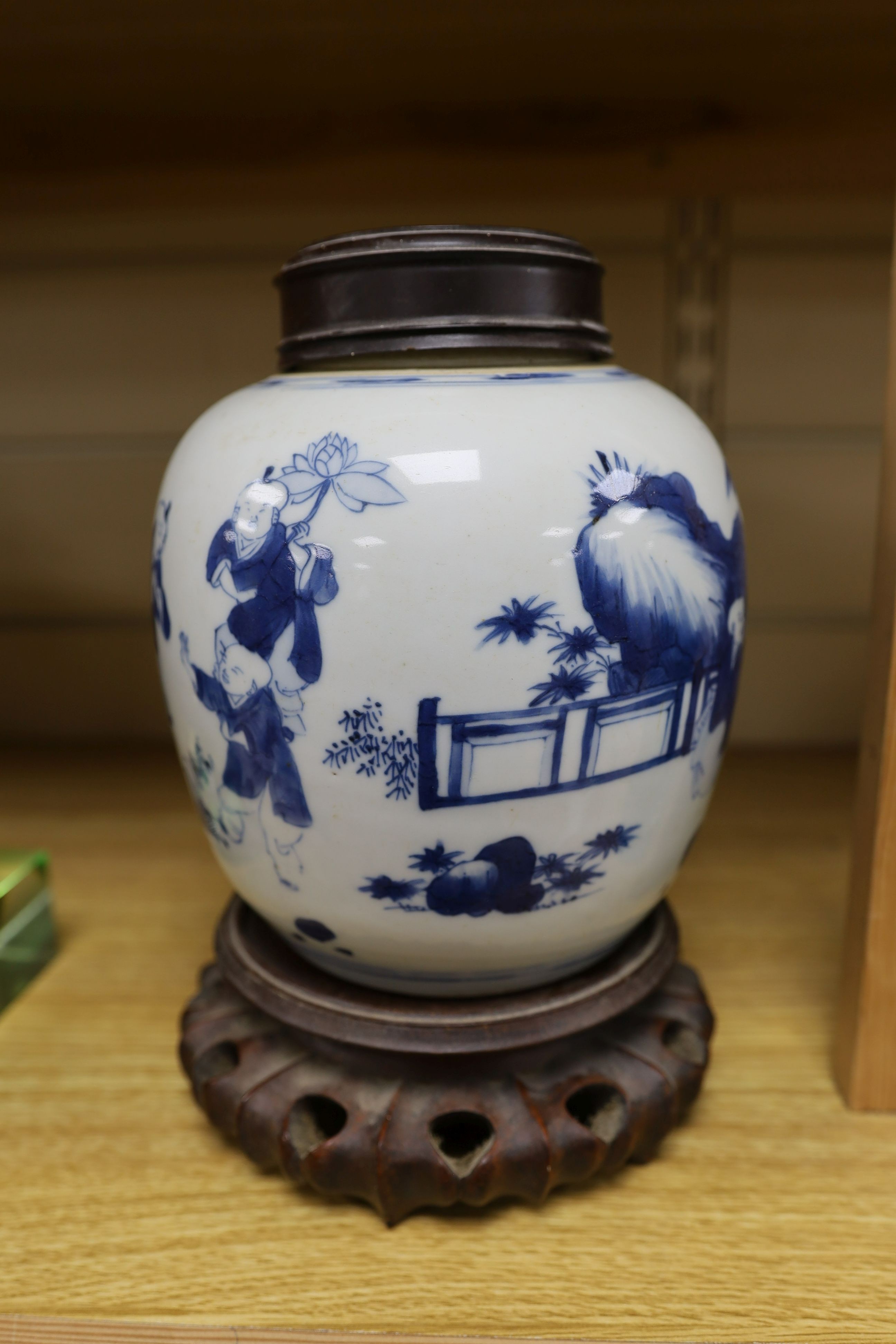 A Chinese blue and white 'boys' jar, 19th century, wood cover and stand, total height 24cm high